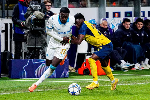 2025-12-09 R. Union Saint-Gilloise v Olympique de Marseille - UEFA Champions League 2025 26 League Phase MD6 BRUSSELS, BELGIUM - DECEMBER 9: Timothy Weah of Olympique de Marseille, Ousseynou Niang of R. Union Saint-Gilloise battle for the ball during the UEFA Champions League 2025 26 League Phase MD6 match between R. Union Saint-Gilloise and Olympique de Marseille at RSC Anderlecht Stadium on December 9, 2025 in Brussels, Belgium. (Photo by Gabriel Calvino Alonso BSR Agency) Brussels Belgium Content not available for redistribution in The Netherlands directly or indirectly through any third parties. Copyright: xBSRxAgencyx