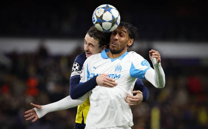 Union s Kamiel Van De Perre and Marseille s Pierre-Emerick Aubameyang fight for the ball during a soccer game between Belgian Royale Union Saint-Gilloise and French Olympique de Marseille, on Tuesday 09 December 2025 in Brussels, on the sixth day of the League phase of the UEFA Champions League tournament. VIRGINIExLEFOUR  x147757493x
