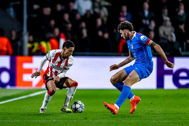 PSV Eindhoven defender Mauro Junior, Atletico de Madrid defender Matteo Ruggeri, during the match PSV Eindhoven vs Atletico de Madrid at the Philips stadium for the Champions League phase Matchday 6 season 2025 2026 in EINDHOVEN, Netherlands on 9 December 2025, photo by Stefan Koops EYE4images DeFodi Images