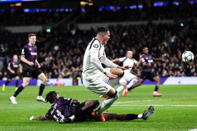 London, England, 9th December 2025. Youssoupha Sanyang of Slavia Prague fouls Pedro Porro of Tottenham for a penalty during the Tottenham Hotspur vs Slavia Prague UEFA Champions League match at the Tottenham Hotspur Stadium, London. Picture credit should read: David Klein Sportimage EDITORIAL USE ONLY. No use with unauthorised audio, video, data, fixture lists, club league logos or live services. Online in-match use limited to 120 images, no video emulation. No use in betting, games or single club league player publications. SPI_043_DK_TOT_SLA SPI-4359-0045