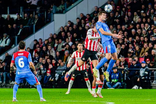 Alexander Sorloth of Atletico de Madrid heads the ball with Joey Veerman of PSV Eindhoven PSV Eindhoven v Atletico de Madrid, UEFA Champions League 2025 26 League Phase MD6, PSV Eindhoven v Atletico de Madrid, PSV Stadion, December 9, 2025, Eindhoven, Netherlands.