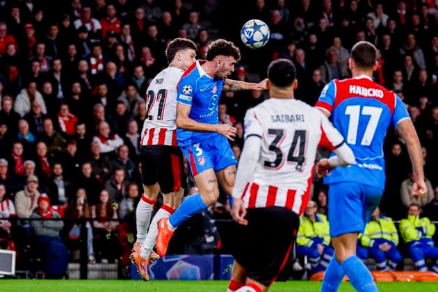 Dennis Man of PSV Eindhoven and Matteo Ruggeri of Atletico Madrid compete for the headed ball PSV Eindhoven v Atletico de Madrid, UEFA Champions League 2025 26 League Phase MD6, PSV Eindhoven v Atletico de Madrid, PSV Stadion, December 9, 2025, Eindhoven, Netherlands.