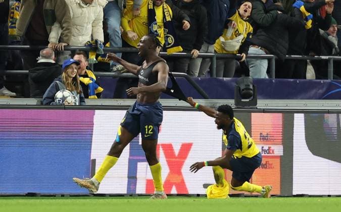Union s Promise David celebrates during a soccer game between Belgian Royale Union Saint-Gilloise and French Olympique de Marseille, on Tuesday 09 December 2025 in Brussels, on the sixth day of the League phase of the UEFA Champions League tournament. VIRGINIExLEFOUR  x147772346x