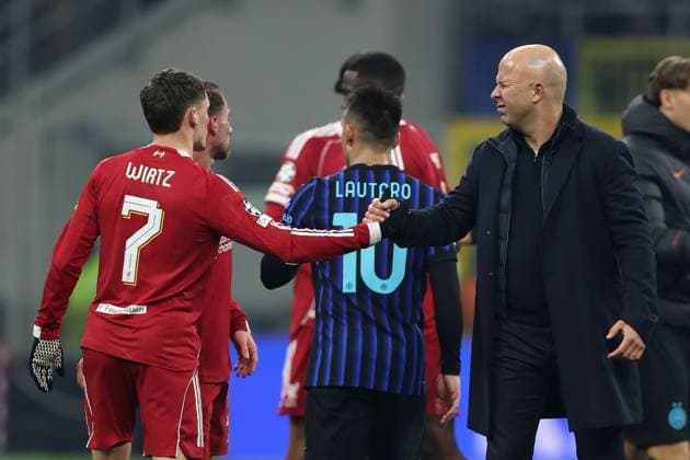 Liverpool manager Arne Slot celebrates with Florian Wirtz at full time Inter Milan v Liverpool, UEFA Champions League, Group Stage, Football, San Siro Stadium, Milan, Italy- 09 Dec 2025Milan San Siro Italy EDITORIAL USE ONLY No use with unauthorised audio, video, data, fixture lists, club league logos or live services. Online in-match use limited to 120 images, no video emulation. No use in betting, games or single club league player publications. Copyright: xKieranxMcManus Shutterstockx 16009887bd