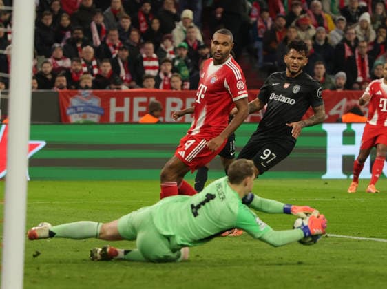 (251210) -- MUNICH, Dec. 10, 2025 -- Manuel Neuer (front), goalkeeper of Bayern Munich, makes a save during the UEFA Champions League football match between Bayern Munich and Sporting CP in Munich, Germany, Dec. 9, 2025. (Photo by Xinhua) (SP)GERMANY-MUNICH-FOOTBALL-UEFA CHAMPIONS LEAGUE-BAYERN MUNICH VS SPORTING CP PhilippexRuiz 