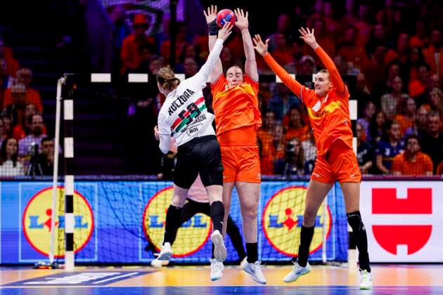 Csenge Kuczora of Hungary throw the ball under pressure from Romee Maarschalkerweerd of the Netherlands and Kelly Dulfer of the Netherlands Netherlands v Hungary, Quarter finals - 27th IHF Women s Handball World Championship, WM, Weltmeisterschaft Netherlands v Hungary, Ahoy, December 10, 2025, Rotterdam, Netherlands.