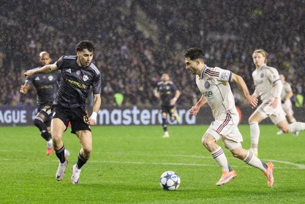 BAKU , 10-12-2025 , Tofiq Bahramov Stadion , Season 2025 2026 , UEFA Champions League football , match between FK Qarabag and Ajax Amsterdam , picture shows Qarabag FK player Bahlul Mustafazade and Ajax player Raul Moro Qarabag - Ajax  x200102995x Copyright: