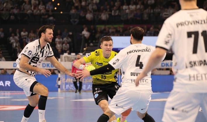 Photo on the ball Simone MENGON Stuttgart against Domagoj Duvnjak Kiel and left Veron Nacinovic Kiel Handball Men 1 Bundesliga on Wed 10 12 2025 THW Kiel TVB Stuttgart