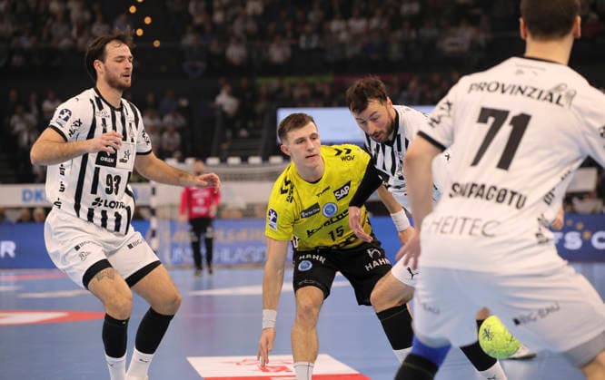 Photo on the ball Simone MENGON Stuttgart against Domagoj Duvnjak Kiel and left Veron Nacinovic Kiel Handball Men 1 Bundesliga on Wed 10 12 2025 THW Kiel TVB Stuttgart