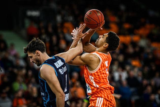 Berkan Durmaz Turk Telekom Ankara and Mark Smith ratiopharm ulm battle for the ball during the Basketball Eurocup match between ratiopharm ulm and Turk Telekom Ankara at ratiopharm Arena on December 10, 2025 in Neu Ulm, Germany Photo by Harry Langer DeFodi Images