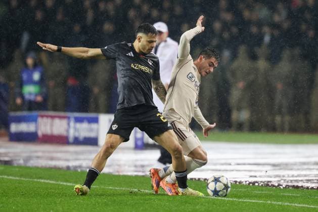 BAKU , 10-12-2025 , Tofiq Bahramov Stadion , Season 2025 2026 , UEFA Champions League football , match between FK Qarabag and Ajax Amsterdam , picture shows Qarabag FK player Matheus Silva and Ajax player Lucas Rosa Qarabag - Ajax  x200103970x Copyright: