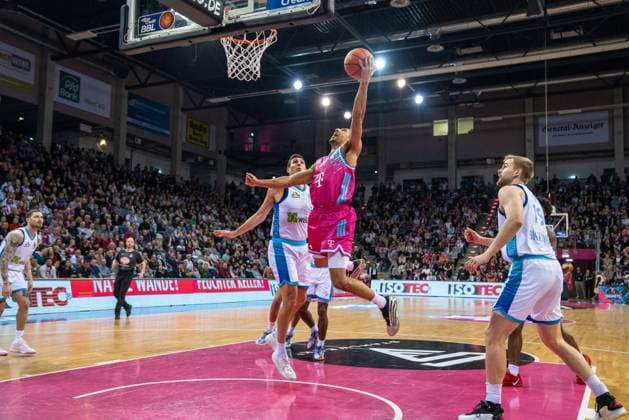 Joel Aminu 21, Telekom Baskets Bonn with a shot attempt at the basket Ryan Hawkins 33 Frankfurt Skyliners , Till Pape 19 Frankfurt Skyliners and Logan Johnson 0 Frankfurt Skyliners under the basket Telekom Baskets Bonn vs Frankfurt Skyliners Copyright: xFeyzullahxGökalpx