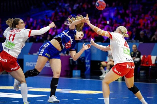 ROTTERDAM - Line Haugsted (DEN), Clarisse Mairot (FRA), and Michala Elsberg Moller (DEN) during the World Handball Championship quarterfinal between Denmark and France in Ahoy Rotterdam. ANP ROBIN VAN LONKHUIJSEN xVIxANPxSportx xxANPxIVx 544518216 originalFilename: 544518216.jpg
