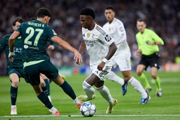 Vinicius Jr of Real Madrid CF and Matheus Nunes of Manchester City FC Real Madrid v Manchester City, UEFA Champions League, Football, Estadio Santiago Bernabeu, Madrid, Spain - 10 Dec 2025Madrid Estadio Santiago Bernabu Spain EDITORIAL USE ONLY No use with unauthorised audio, video, data, fixture lists, club league logos or live services. Online in-match use limited to 120 images, no video emulation. No use in betting, games or single club league player publications. Copyright: xRubenxAlbarran Shutterstockx 16073023c