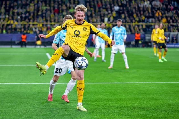 10 12 2025, Football, UEFA Champions League, Borussia Dortmund FK Bodö Glimt, BVB Stadion, Matchday 5, Season 2025 2026 Julian Brandt BVB 10 in duel against Fredrik Sjovold Bodo Glimt 20 Regulations prohibit any use of photographs as image sequences and or quasi video North Rhine-Westphalia Germany
