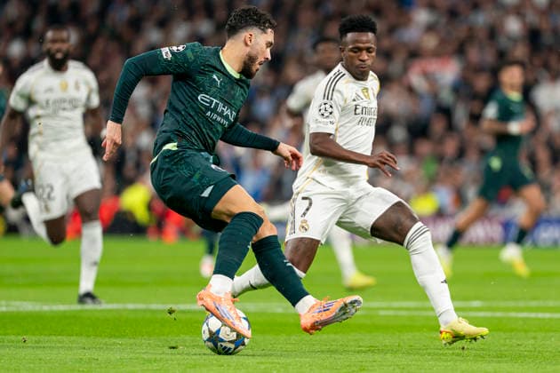 REAL MADRID CF v MANCHESTER CITY FC. CHAMPIONS LEAGUE 2025 2026. ROUND 6. Real Madrid CF s Vinicius Junior (R) and Manchester City FC s Rayan Cherki during Champions League 2025 2026 match. December 10,2025. (ALTERPHOTOS Ropero) MadridSpain  Copyright: xRoperox