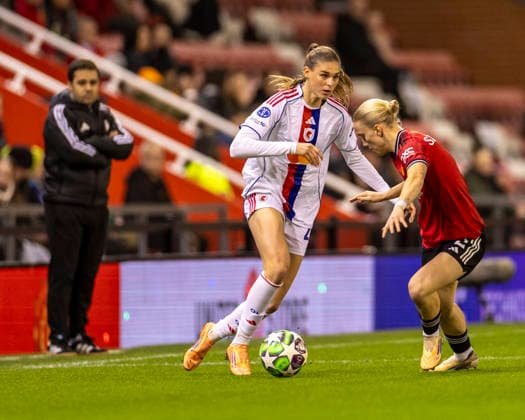 10th December 2025; Leigh Sports Village, Manchester, England; Womens Champions League Football, Manchester United, ManU versus Lyon Women; Julie Brand of OL Lyonnes under pressure from Anna Sandberg of Manchester United Women  TimxWilliams