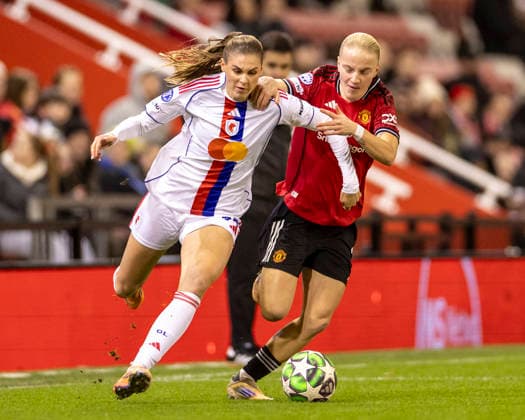 10th December 2025; Leigh Sports Village, Manchester, England; Womens Champions League Football, Manchester United, ManU versus Lyon Women; Julie Brand of OL Lyonnes under pressure from Anna Sandberg of Manchester United Women  TimxWilliams
