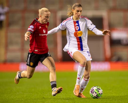 10th December 2025; Leigh Sports Village, Manchester, England; Womens Champions League Football, Manchester United, ManU versus Lyon Women; Julie Brand of OL Lyonnes under pressure from Anna Sandberg of Manchester United Women  TimxWilliams