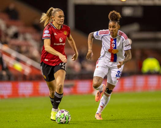10th December 2025; Leigh Sports Village, Manchester, England; Womens Champions League Football, Manchester United, ManU versus Lyon Women; Fridolina Rolfo of Manchester United Women under pressure from Tarciane of OL Lyonnes  TimxWilliams
