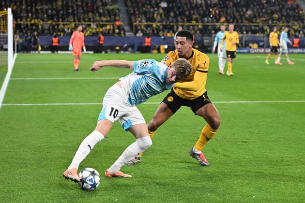 Jens Petter Hauge FK Bodo Glimt and Jobe Bellingham Borussia Dortmund battle for the ball during the UEFA Champions League 2025 26, matchday 6 league phase match between Borussia Dortmund and FK Bodo Glimt, BVB Stadion on December 10, 2025 in Dortmund, Germany, Germany Photo by Ralf Treese DeFodi Images Jens Petter Hauge FK Bodo Glimt and Jobe Bellingham Borussia Dortmund battle for the ball during the UEFA Champions League 2025 26 League Phase MD6 match between Borussia Dortmund and FK Bodo Glimt at BVB Stadion Dortmund on December 10, 2025 in Dortmund, Germany Photo by Ralf Treese DeFodi Images