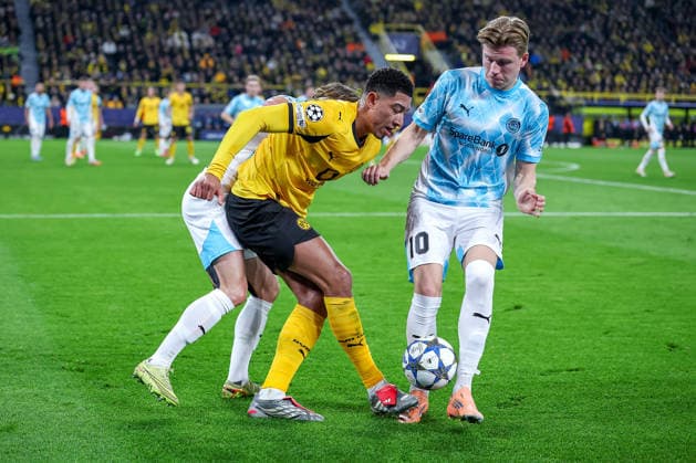 10 12 2025, Football, UEFA Champions League, Borussia Dortmund FK Bodö Glimt, BVB Stadion, Matchday 5, Season 2025 2026 Jobe Bellingham BVB 07 in a duel against Patrick Berg Bodo Glimt 07 and Jens Petter Hauge Bodo Glimt 10 Regulations prohibit any use of photographs as image sequences and or quasi video Nordrhein Westfalen Germany