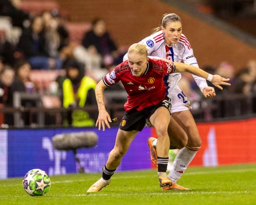 10th December 2025; Leigh Sports Village, Manchester, England; Womens Champions League Football, Manchester United, ManU versus Lyon Women; Julie Brand of OL Lyonnes under pressure from Anna Sandberg of Manchester United Women  TimxWilliams