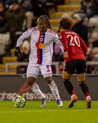 10th December 2025; Leigh Sports Village, Manchester, England; Womens Champions League Football, Manchester United, ManU versus Lyon Women; Melchie Dumornay of OL Lyonnes under pressure from Hinata Miyazawa of Manchester United Women  TimxWilliams