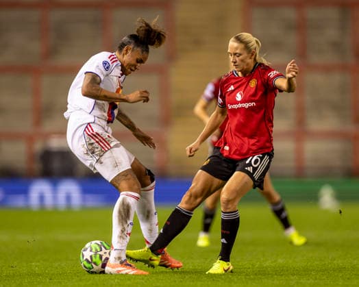 10th December 2025; Leigh Sports Village, Manchester, England; Womens Champions League Football, Manchester United, ManU versus Lyon Women; Tarciane of OL Lyonnes is tackled by Lisa Naalsund of Manchester United Women  TimxWilliams