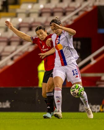 10th December 2025; Leigh Sports Village, Manchester, England; Womens Champions League Football, Manchester United, ManU versus Lyon Women; Ashley Lawrence of OL Lyonnes under pressure from Rachel Williams of Manchester United Women  TimxWilliams