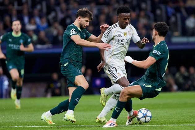 December 10, 2025, Madrid, Madrid, Spain: Vinicius Jr of Real Madrid CF and Ruben Dias of Manchester City FC during the UEFA Champions League football match between Real Madrid CF and Manchester City FC at Santiago Bernabeu Stadium in Madrid, Spain, december 10, 2025 Madrid Spain - ZUMAa206 20251210_zsp_a206_044 Copyright: xRubenxAlbarranx