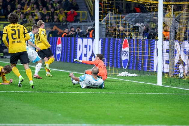 10 12 2025, Football, UEFA Champions League, Borussia Dortmund FK Bodö Glimt, BVB Stadion, Matchday 5, Season 2025 2026 Shot on goal to 2 1 by scorer Julian Brandt BVB 10 Regulations prohibit any use of photographs as image sequences and or quasi video Nordrhein Westfalen Germany