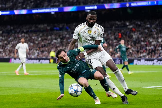 Real Madrid C.F. v Manchester City - UEFA Champions League 2025 26 League Phase MD6 Bernardo Silva attacking midfield of Manchester City and Portugal and Antonio Rudiger centre-back of Real Madrid and Germany compete for the ball during the UEFA Champions League 2025 26 League Phase MD6 match between Real Madrid C.F. and Manchester City at Estadio Santiago Bernabeu on December 10, 2025 in Madrid, Spain. Madrid Spain  Copyright: xJosexBretonx originalFilename:bretonhernandez-realmadr251210_npmbt.jpg
