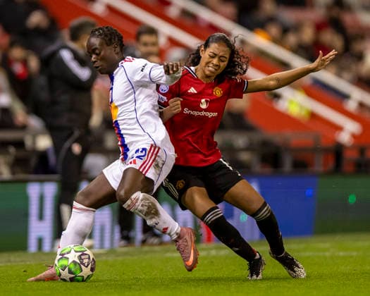 10th December 2025; Leigh Sports Village, Manchester, England; Womens Champions League Football, Manchester United, ManU versus Lyon Women; Tabitha Chawinga of OL Lyonnes under pressure from Jayde Riviere of Manchester United Women  TimxWilliams