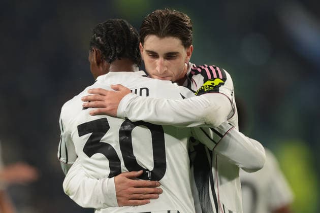 Turin, Italy, 10th December 2025. Jonathan David of Juventus celebrates with team mate Fabio Miretti after scoring to give the hosts a 2-0 lead during the Juventus vs Pafos FC UEFA Champions League match at Juventus Stadium, Turin. Picture credit should read: Jonathan Moscrop Sportimage EDITORIAL USE ONLY. No use with unauthorised audio, video, data, fixture lists, club league logos or live services. Online in-match use limited to 120 images, no video emulation. No use in betting, games or single club league player publications. SPI_077_JM_JUVE_PAFOS_UCL SPI-4325-0077