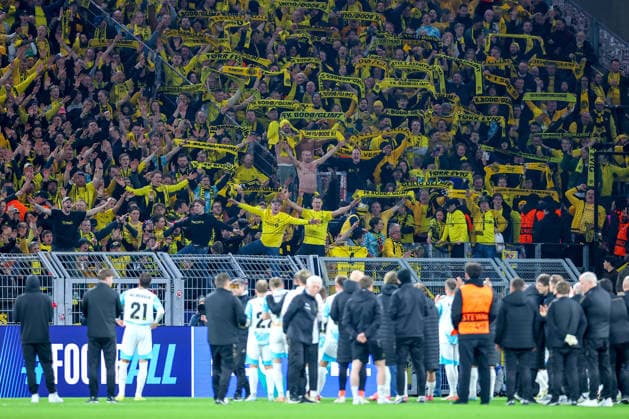 10 12 2025, Football, UEFA Champions League, Borussia Dortmund FK Bodö Glimt, BVB Stadion, Matchday 5, Season 2025 2026 The fans in the visitors block celebrate the team Regulations prohibit any use of photographs as image sequences and or quasi video North Rhine-Westphalia Germany