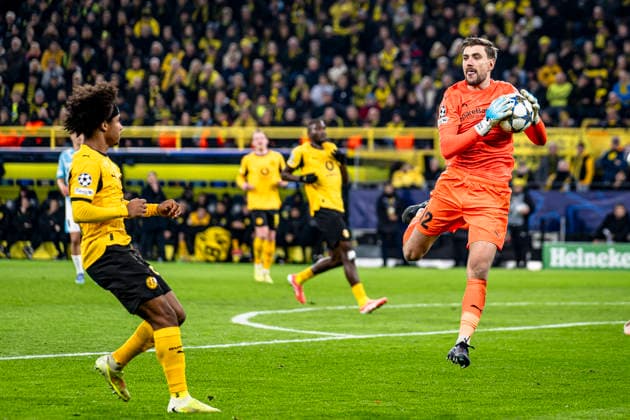 Borussia Dortmund forwarder Karim Adeyemi, Bodo Glimt goalkeeper Nikita Haikin, during the match Borussia Dortmund vs FK Bodo Glimt at the BVB Stadion Dortmund for the Champions League League phase Matchday 6 season 2025 2026 in DORTMUND, Germany on 10 December 2025, photo by Stefan Koops EYE4images DeFodi Images
