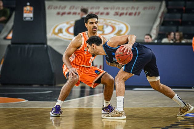 Mark Smith ratiopharm ulm and Michael Jaden Devoe Turk Telekom Ankara battle for the ball during the Basketball Eurocup match between ratiopharm ulm and Turk Telekom Ankara at ratiopharm Arena on December 10, 2025 in Neu Ulm, Germany Photo by Harry Langer DeFodi Images
