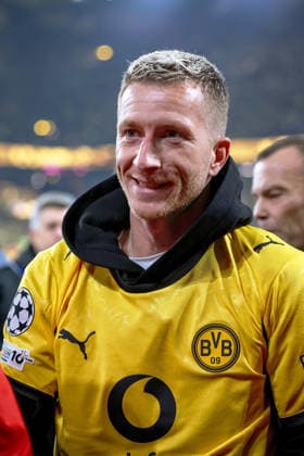 10 12 2025, Football, UEFA Champions League, Borussia Dortmund FK Bodö Glimt, BVB Stadion, Matchday 5, Season 2025 2026 Marco Reus with BVB Fan Jersey Jersey by Karim Adeyemi BVB 27 Regulations prohibit any use of photographs as image sequences and or quasi video Nordrhein Westfalen Germany