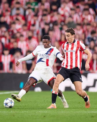 Athletic Club v Paris Saint-Germain FC - UEFA Champions League 2025-26 League Phase MD6 Asier Hierro of Athletic Club competes for the ball with Nuno Mendes of Paris Saint-Germain during the UEFA Champions League 2025-26 League Phase MD6 match between Athletic Club and Paris Saint-Germain FC at San Mames on December 10, 2025, in Bilbao, Spain. Bilbao San Mames Basque Coountry Spain RL_ATHvPSG_CL_000269 Copyright: xRicardoxLarreinax