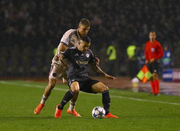 Qarabag FK v Ajax - UEFA Champions League BAKU, AZERBAIJAN - DECEMBER 10: Qarabag FK’s Pedro Bicalho (front) competes against an Ajax player during the UEFA Champions League group stage MD6 match between Qarabag FK and AFC Ajax at Tofiq Bahramov Stadium in Baku, Azerbaijan, on December 10, 2025. Resul Rehimov Anadolu Baku Azerbaijan. Editorial use only. Please get in touch for any other usage.  Copyright: x2025xAnadoluxResulxRehimovx