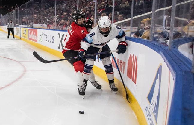 December 10, 2025, Edmonton, Ab, CANADA: United States Haley Winn (8) and Canada s Blayre Turnbull (40) battle for the puck during first period Rivalry Series action in Edmonton on Wednesday, December 10, 2025. Canada News - December 10, 2025  - ZUMAc35_ 20251210_zaf_c35_086 Copyright: xJasonxFransonx