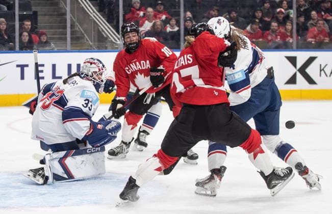 December 10, 2025, Edmonton, Ab, CANADA: United States goalie Gwyneth Philips (33) makes the save as Canada s Emma Maltais (27), Sarah Fillier (10) and United States Caroline Harvey (4) battle in front during first period Rivalry Series action in Edmonton on Wednesday, December 10, 2025. Canada News - December 10, 2025  - ZUMAc35_ 20251210_zaf_c35_088 Copyright: xJasonxFransonx