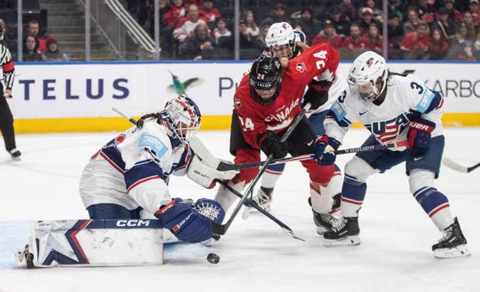 December 10, 2025, Edmonton, Ab, CANADA: United States goalie Gwyneth Philips (33) makes the save on Canada s Natalie Spooner (24) as Cayla Barnes (3) defends during first period Rivalry Series action in Edmonton on Wednesday, December 10, 2025. Canada News - December 10, 2025  - ZUMAc35_ 20251210_zaf_c35_095 Copyright: xJasonxFransonx