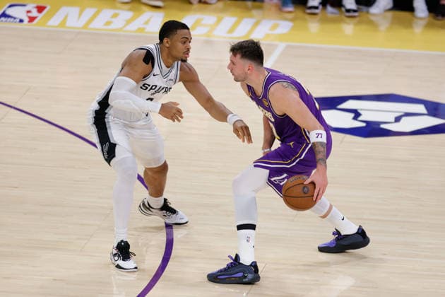 LOS ANGELES, CA - DECEMBER 10: Los Angeles Lakers forward guard Luka Doncic (77) guarded by San Antonio Spurs forward guard Keldon Johnson (3) during the San Antonio Spurs vs Los Angeles Lakers 2025 NBA, Basketball Herren, USA Cup quarterfinals game on December 10, 2025, at Crypto.com Arena in Los Angeles, CA. (Photo by Jevone Moore Icon Sportswire) NBA: DEC 10 San Antonio Spurs at Los Angeles Lakers EDITORIAL USE ONLY Icon20251210036
