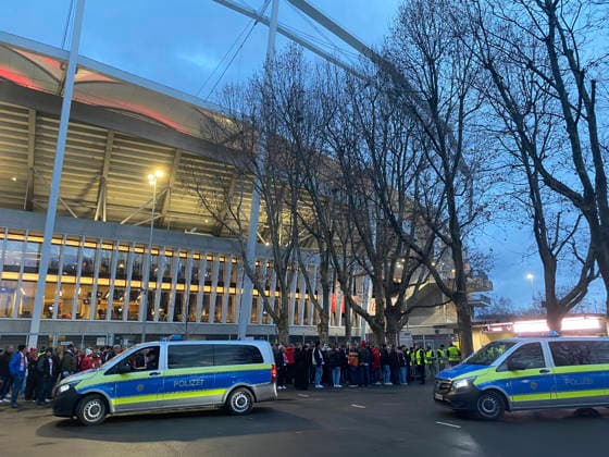 before start of match admission control long queue in front of entrance fans police car police in front of stadium blue hour VfB Stuttgart vs Maccabi Tel Aviv FC EUROPA LEAGUE EL 11 12 2025 DFL REGULATIONS PROHIBIT ANY USE OF PHOTOGRAPHS AS IMAGE SEQUENCES AND OR QUASI VIDEO VfB Stuttgart vs Maccabi Tel Aviv FC EUROPA LEAGUE EL