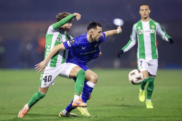 GNK Dinamo v Real Betis Balompie - UEFA Europa League 2025 26 League Phase MD6 Angel Ortiz of Real Betis and Arber Hoxha of Dinamo compete for a ball during the UEFA Europa League 2025 26 League Phase MD6 match between GNK Dinamo and Real Betis Balompie at Stadion Maksimir on December 11, 2025 in Zagreb, Croatia.  MatijaxHabljak PIXSELL