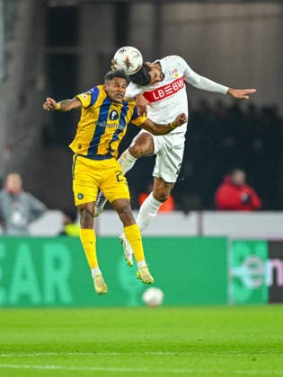 Helio Varela Maccabi Tel Aviv FC and Lorenz Assignon VfB Stuttgart battle for the ball during the UEFA Europa League 2025 26 League Phase MD6 match between VfB Stuttgart and Maccabi Tel Aviv FC at Stuttgart Arena on December 11, 2025 in Stuttgart, Germany Photo by Harry Langer DeFodi Images