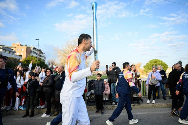 December 11, 2025, Pontedera, Rome, Italy: The Olympic Torch passes through Pontedera, the city of motors for the Milan Cortina 2026 Winter Olympics . Pontedera, Italy 11 December 2025 The Milan Cortina 2026 Olympic Torch.  - ZUMAa289 20251211_zia_a289_080 Copyright: xStefanoxDallexLuchex