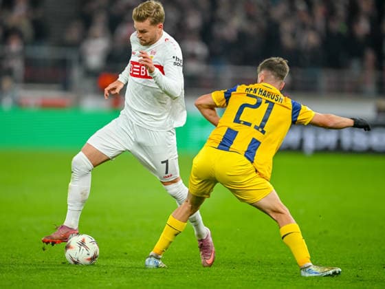 Maximilian Mittelstädt VfB Stuttgart and Noam Ben Harosh Maccabi Tel Aviv FC battle for the ball during the UEFA Europa League 2025 26 League Phase MD6 match between VfB Stuttgart and Maccabi Tel Aviv FC at Stuttgart Arena on December 11, 2025 in Stuttgart, Germany Photo by Harry Langer DeFodi Images
